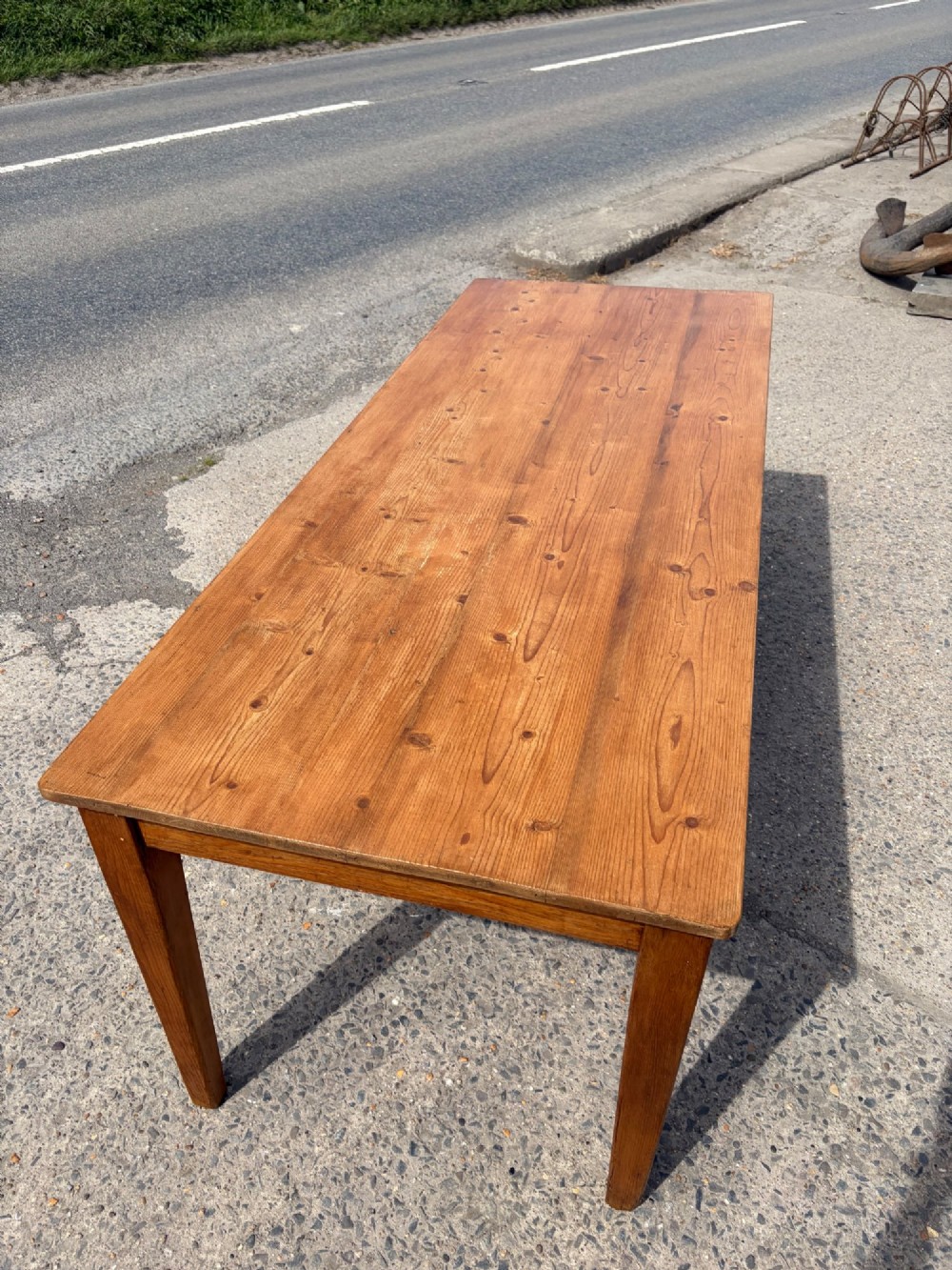 A rectangular Victorian pine table featuring four tapered square legs and a single drawer set into the front frieze. View VI