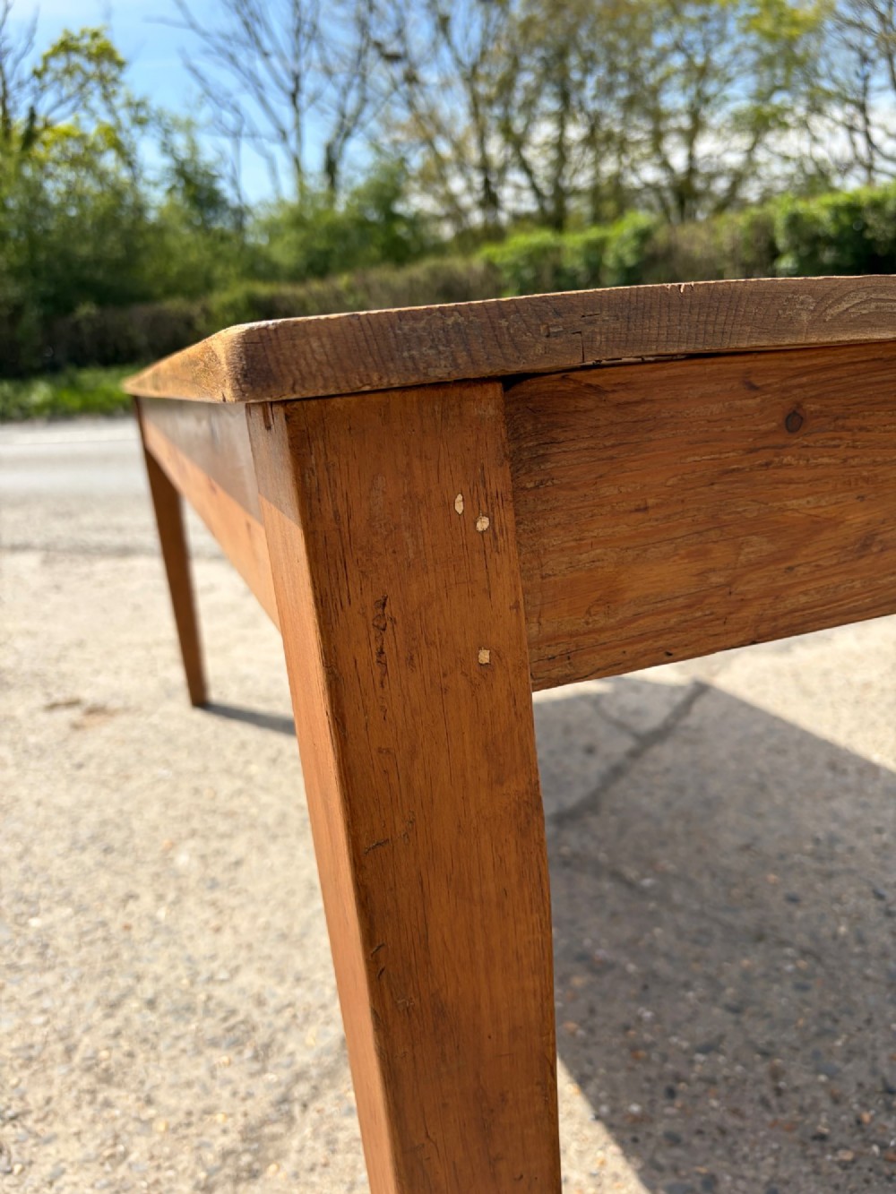 A rectangular Victorian pine table featuring four tapered square legs and a single drawer set into the front frieze. View VIII