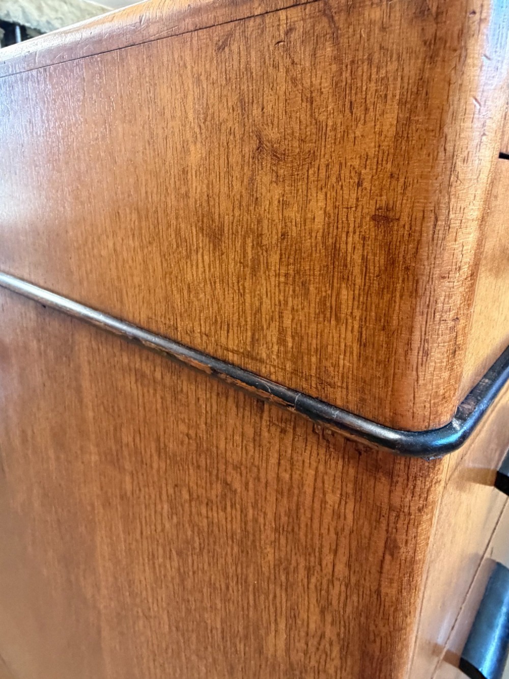A large Art Deco walnut partner desk featuring a brown leather inset top and black horizontal drawer handles. View V