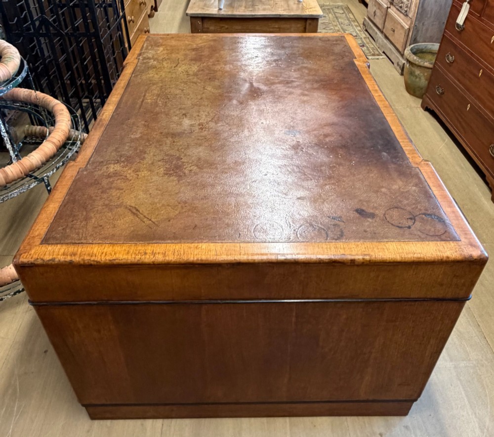 A large Art Deco walnut partner desk featuring a brown leather inset top and black horizontal drawer handles. View XIII