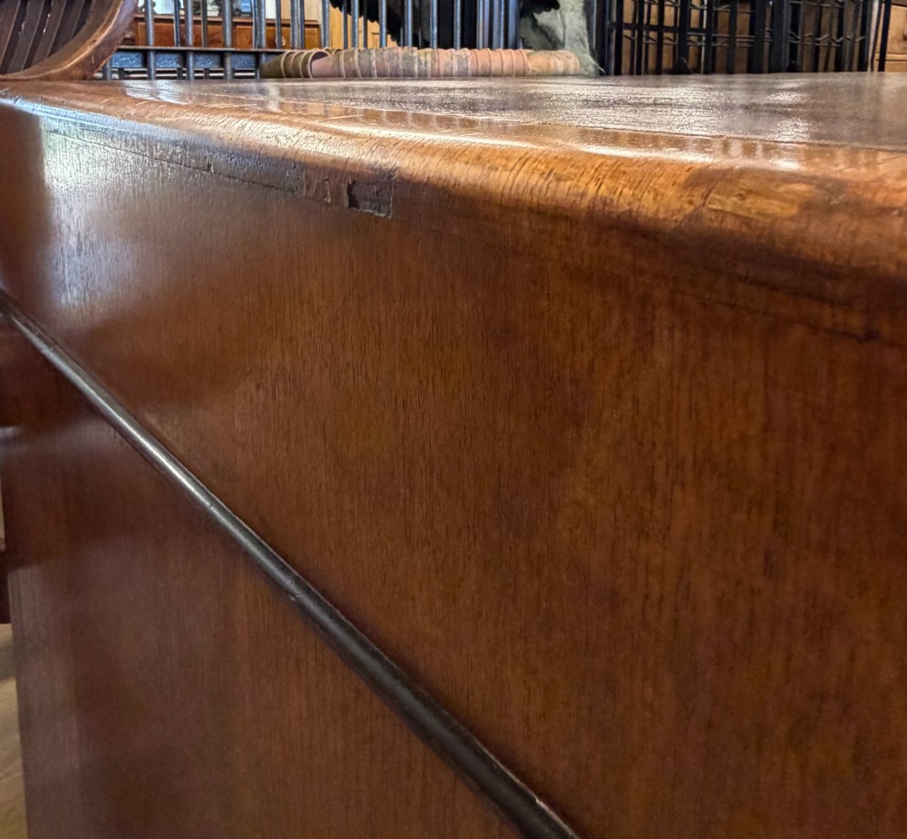 A large Art Deco walnut partner desk featuring a brown leather inset top and black horizontal drawer handles. View XV