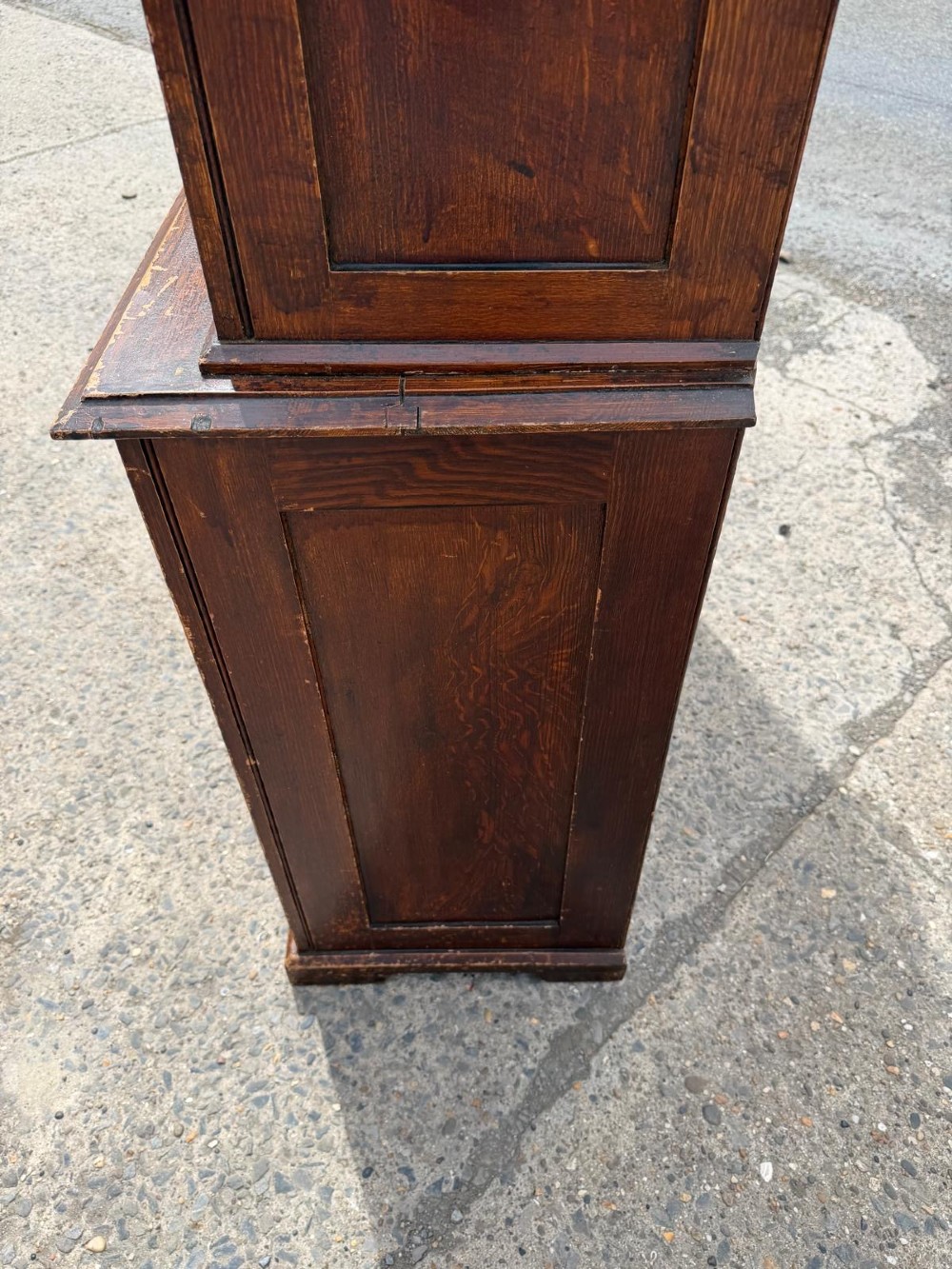 A dark stained Victorian pine dresser featuring a three-door glazed upper display cabinet over a base with three central drawers and two panelled cupboard doors. View X