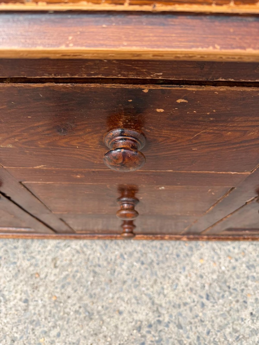 A dark stained Victorian pine dresser featuring a three-door glazed upper display cabinet over a base with three central drawers and two panelled cupboard doors. View XIII