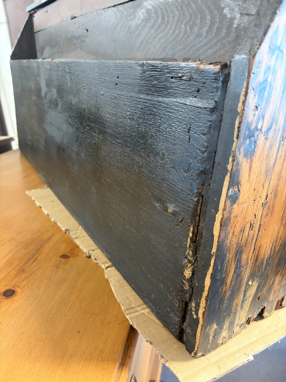 A 19th-century wooden bank of twenty-five individual drawers featuring metal ring pulls and a distressed dark finish. View VI