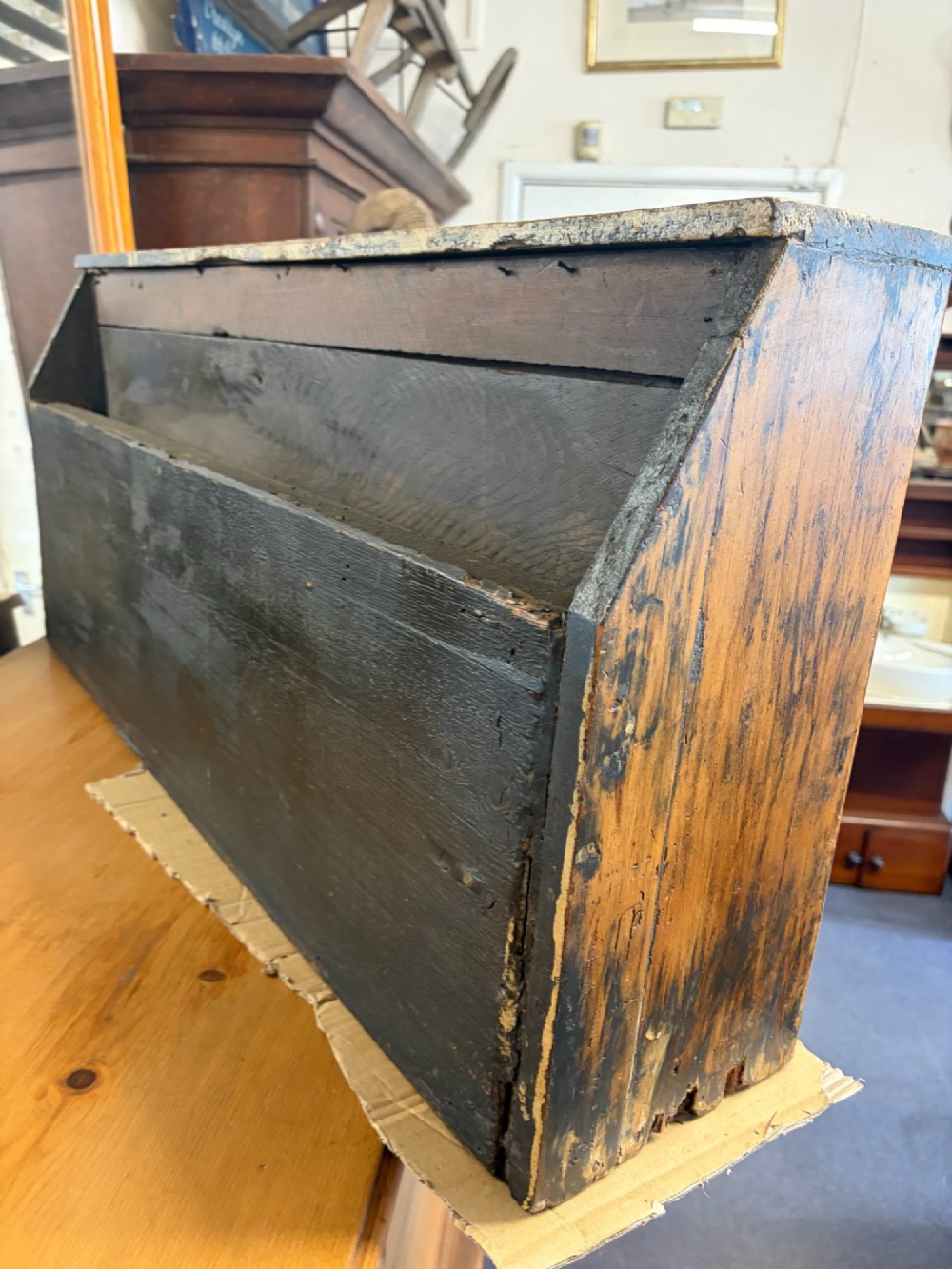 A 19th-century wooden bank of twenty-five individual drawers featuring metal ring pulls and a distressed dark finish. View VII
