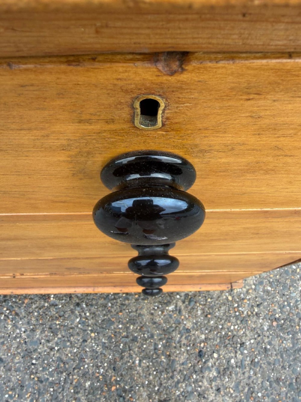 A Victorian pine chest of drawers featuring two small drawers above three graduated long drawers, detailed with dark turned knobs and resting on turned bun feet. View VIII