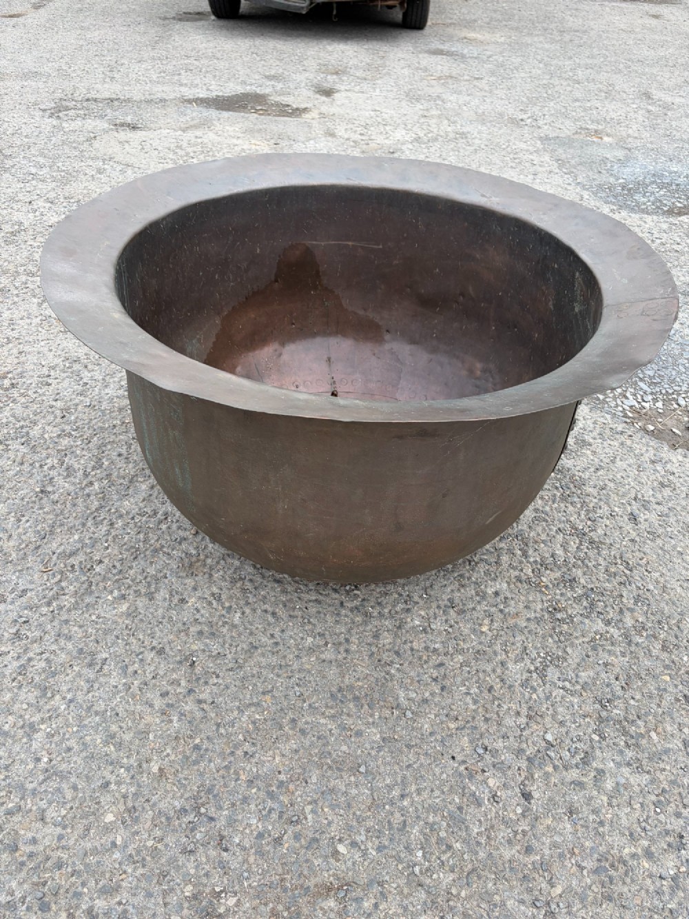 A large 19th-century copper pot featuring a wide flared rim, deep rounded vessel, and dark oxidized copper patina with subtle verdigris details. View II