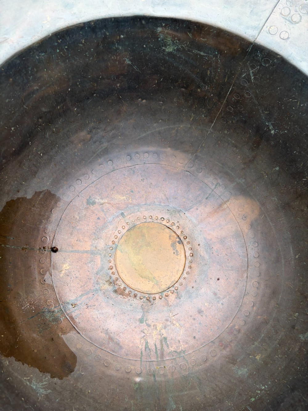 A large 19th-century copper pot featuring a wide flared rim, deep rounded vessel, and dark oxidized copper patina with subtle verdigris details. View IX