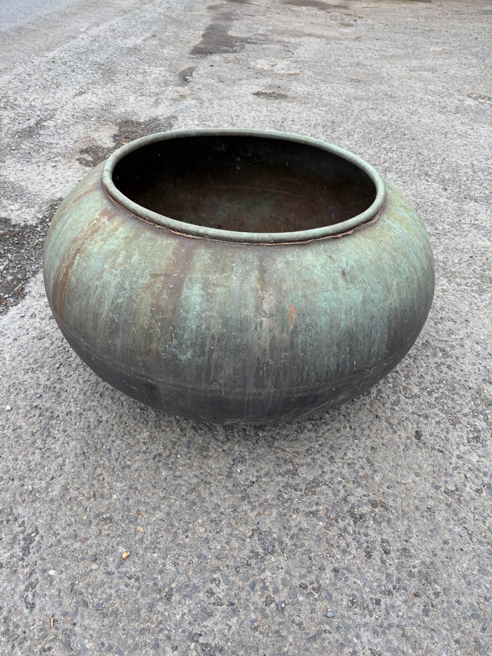A large bulbous 19th-century copper pot featuring a rolled rim and a heavily weathered verdigris patina. View II