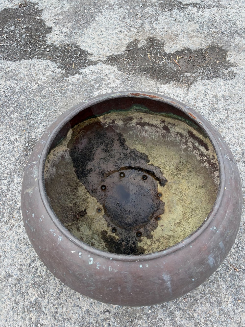 A large 19th-century rounded copper pot with a hand-hammered surface, rolled rim, and dark patinated finish. View III