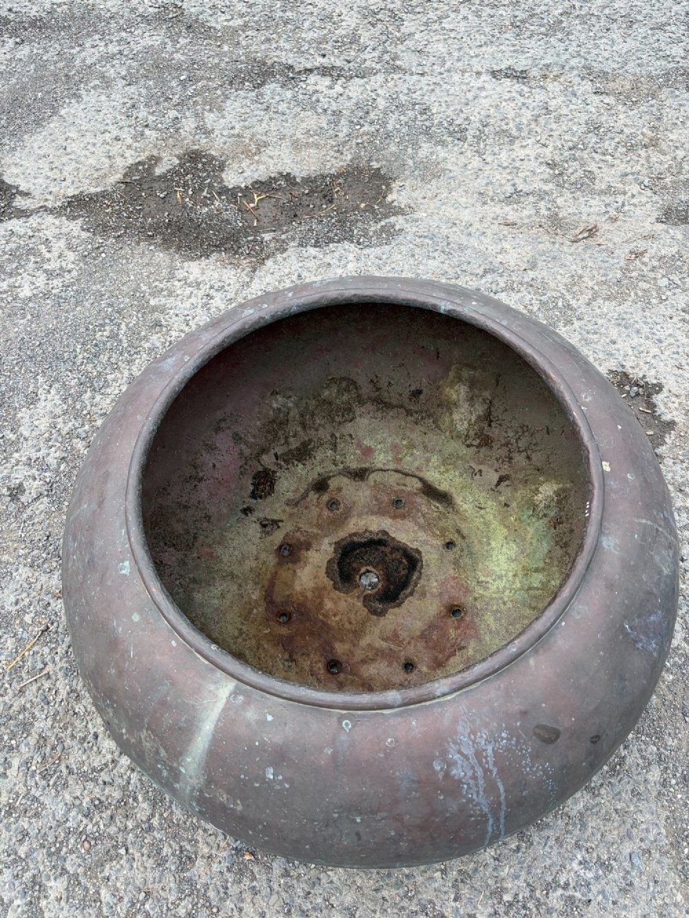 A large bulbous 19th century copper pot featuring a rolled rim, a horizontal seam line, and natural verdigris oxidisation across its surface. View II