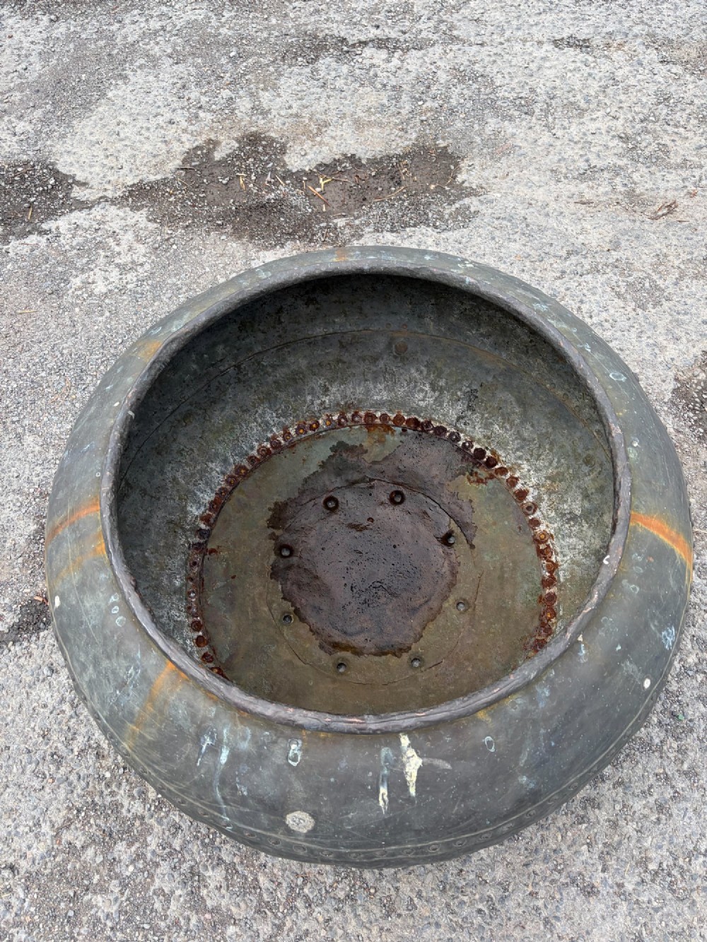 A large bulbous nineteenth-century copper vessel featuring a dark aged patina, riveted band detail, and wide circular opening. View III