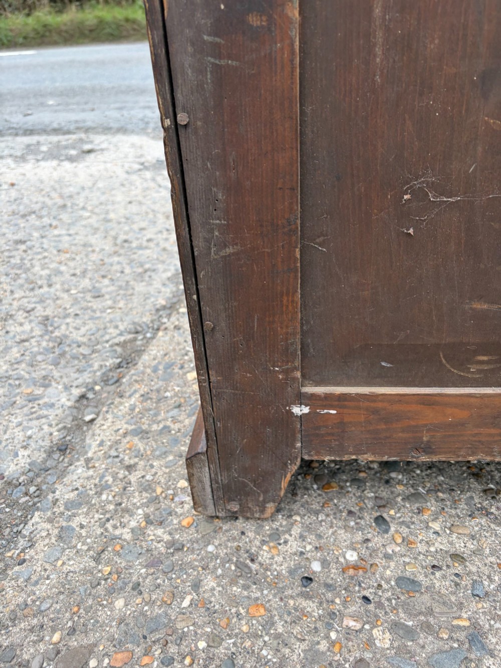 A Victorian warm brown oak chest of drawers featuring two short drawers above four full-width long drawers with turned wooden handles and keyholes. View III