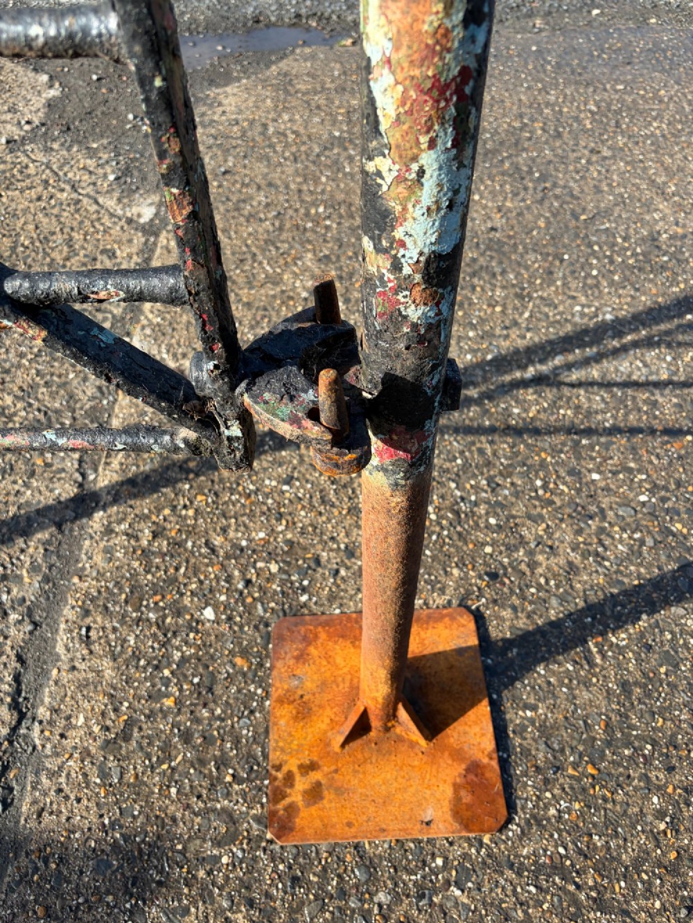 An early 19th-century wrought iron pedestrian field gate with supporting posts, horizontal bars, diagonal bracing, and a weathered paint finish. View VIII