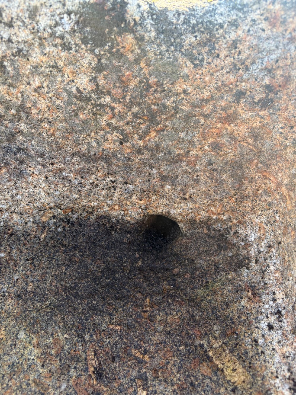 A heavy rectangular antique Cornish granite trough featuring a hand-chiselled rough stone exterior and carved basin. View II