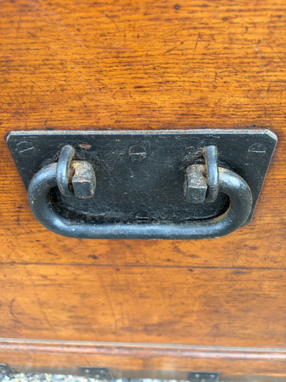 A rectangular Victorian oak silver chest with dark iron corner brackets and a brass plate set into the top lid. View II