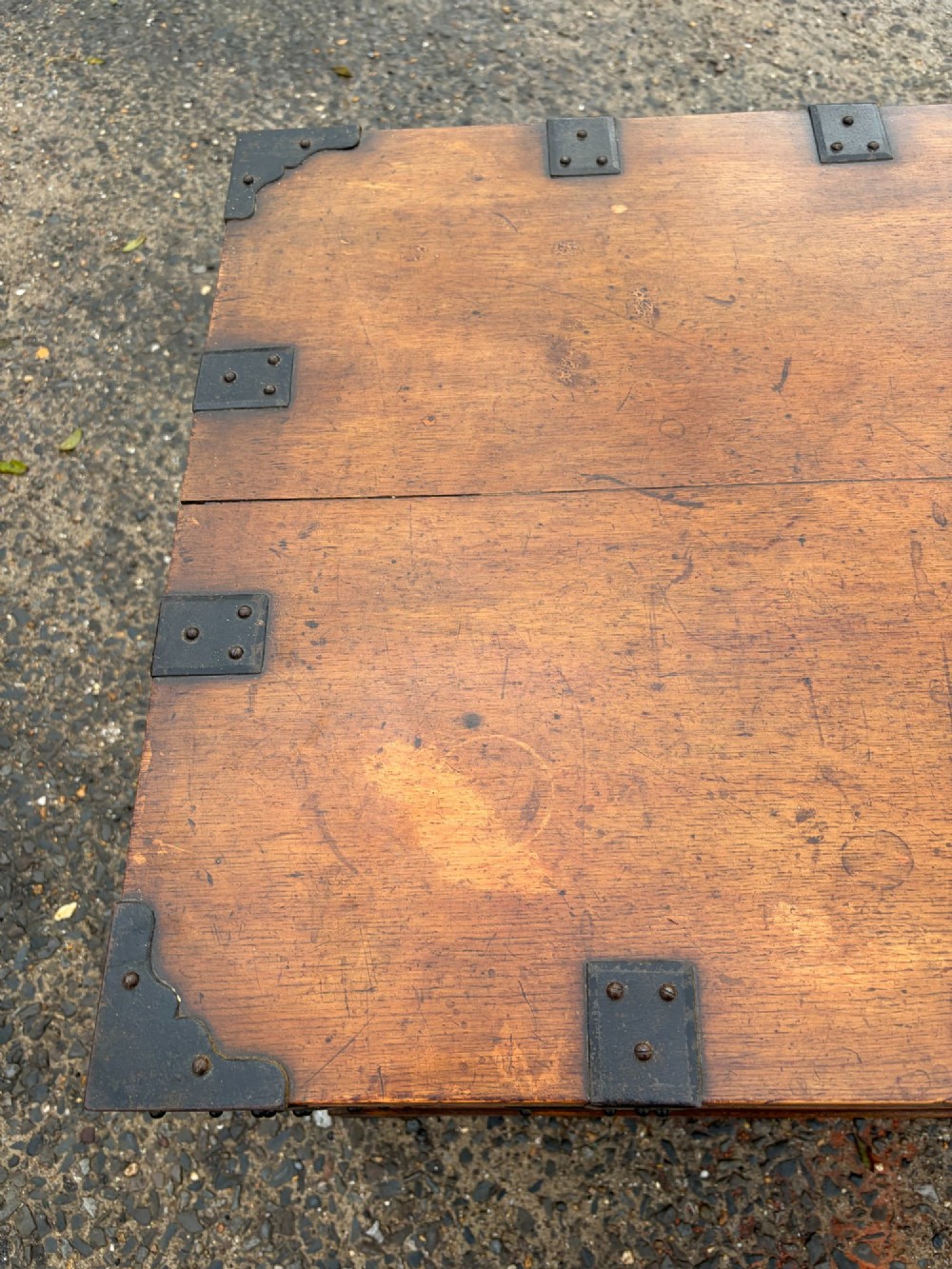A rectangular Victorian oak silver chest with dark iron corner brackets and a brass plate set into the top lid. View VII