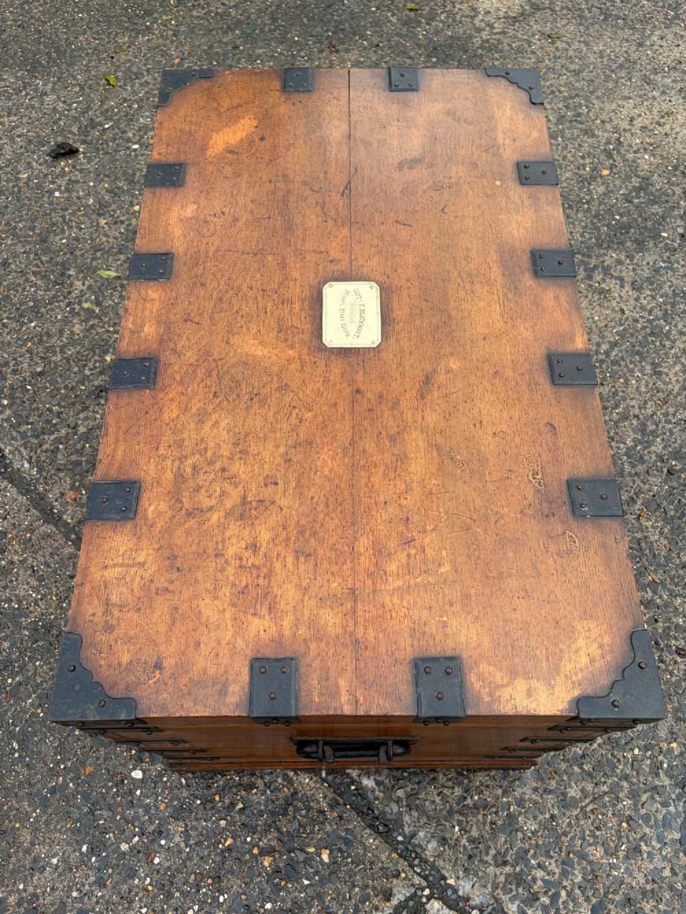 A rectangular Victorian oak silver chest with dark iron corner brackets and a brass plate set into the top lid. View IX