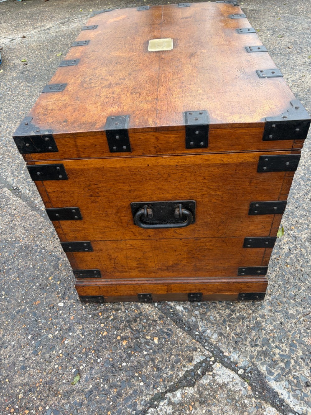 A rectangular Victorian oak silver chest with dark iron corner brackets and a brass plate set into the top lid. View X