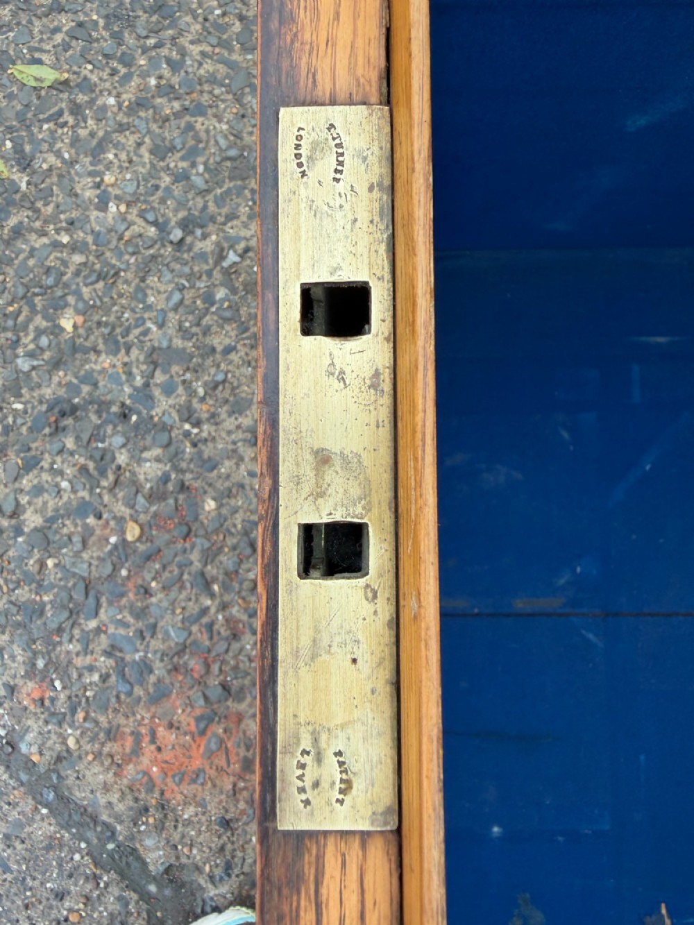 A rectangular Victorian oak silver chest with dark iron corner brackets and a brass plate set into the top lid. View XII