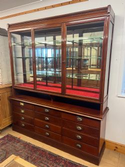 1930S E POLLARD CO LTD MAHOGANY SHOP DISPLAY CABINET WITH DRAWERS TO BASE