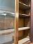 fig 1. A tall mahogany library bookcase featuring two upper glazed doors and two flame mahogany panelled lower cupboard doors.