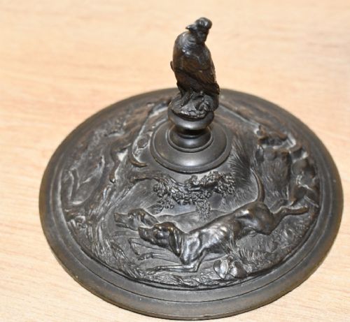 A pair of dark patinated bronze covered urns featuring relief-sculpted avian motifs and stork-shaped handles and finials on tiered bases. View XIII