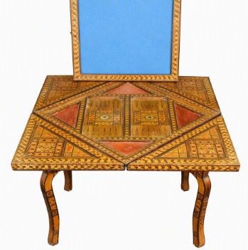 fig 1. A square 19th-century Damascus games table featuring geometric wood marquetry inlay, an envelope-style folding top with a central chessboard, and cabriole legs.