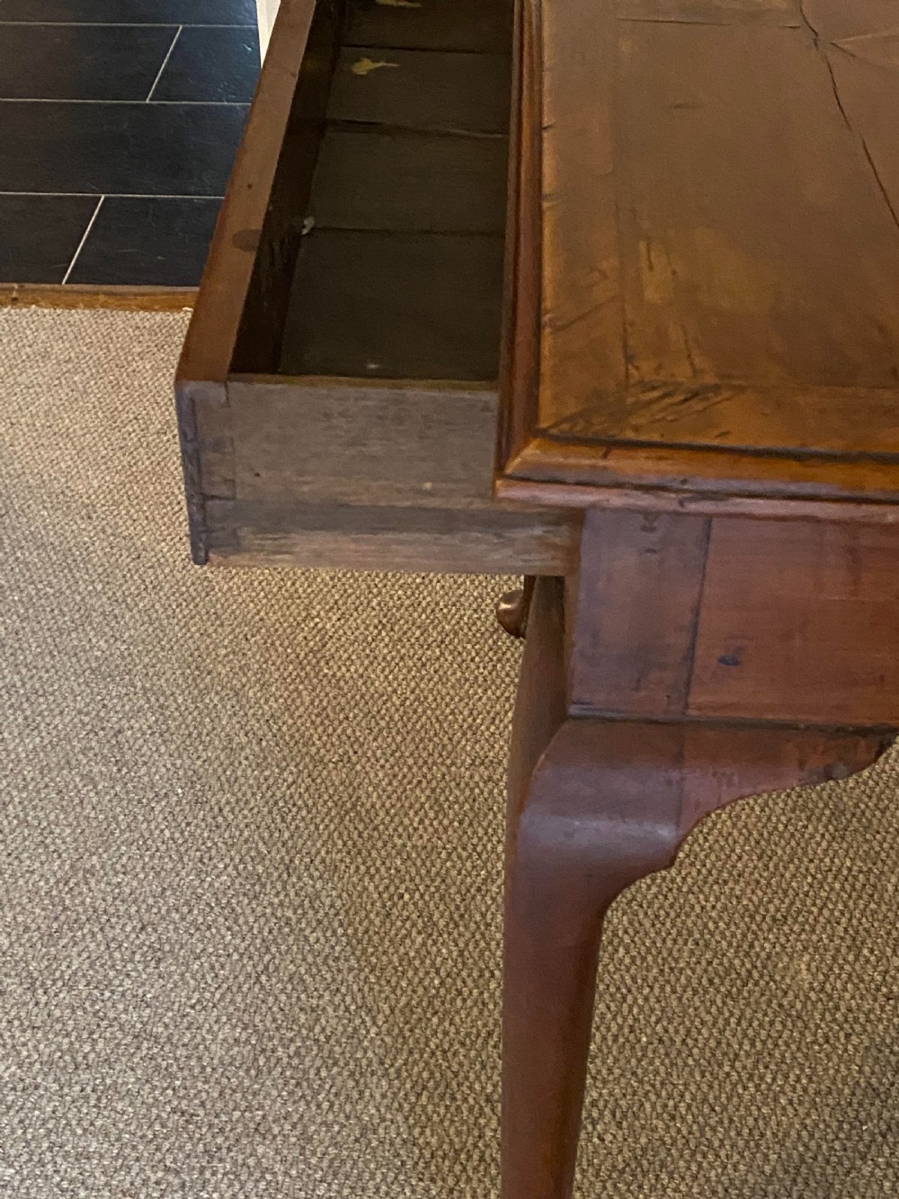 A Georgian fruitwood side table featuring cabriole legs with pad feet, a single drawer with brass handles, and a central star compass inlay on the tabletop. View VIII
