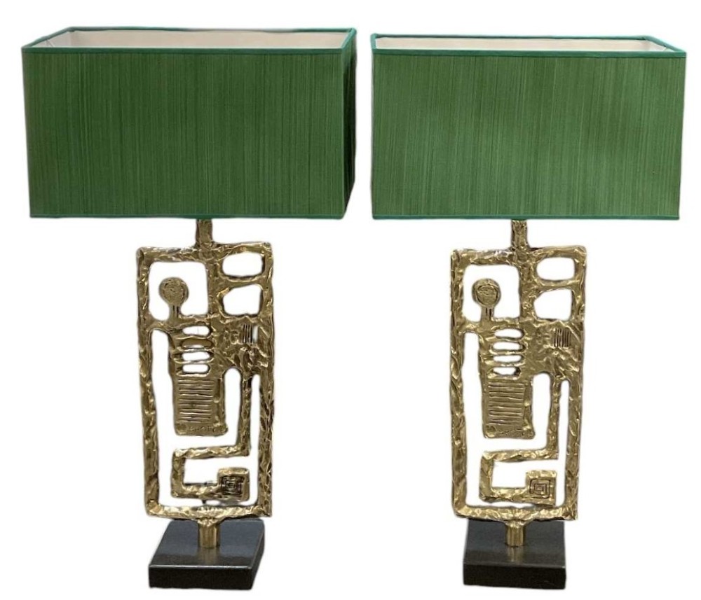 A pair of mid-century Italian abstract cast brass table lamps featuring openwork geometric frames and rectangular green silk lampshades.