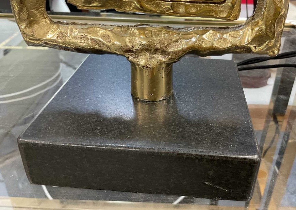 A pair of mid-century Italian abstract cast brass table lamps featuring openwork geometric frames and rectangular green silk lampshades. View V