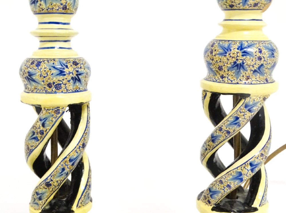 A pair of early 20th-century Kashmiri table lamps with open-spiral turned columns hand-painted in blue floral patterns on a cream lacquered ground. View III