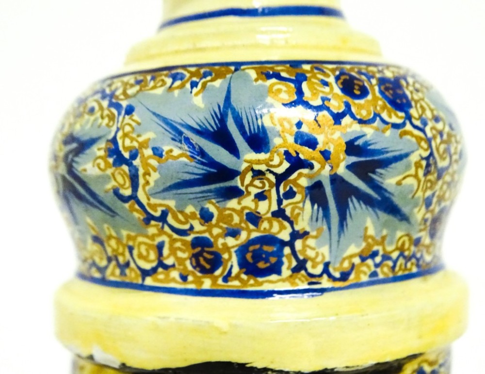 A pair of early 20th-century Kashmiri table lamps with open-spiral turned columns hand-painted in blue floral patterns on a cream lacquered ground. View VI