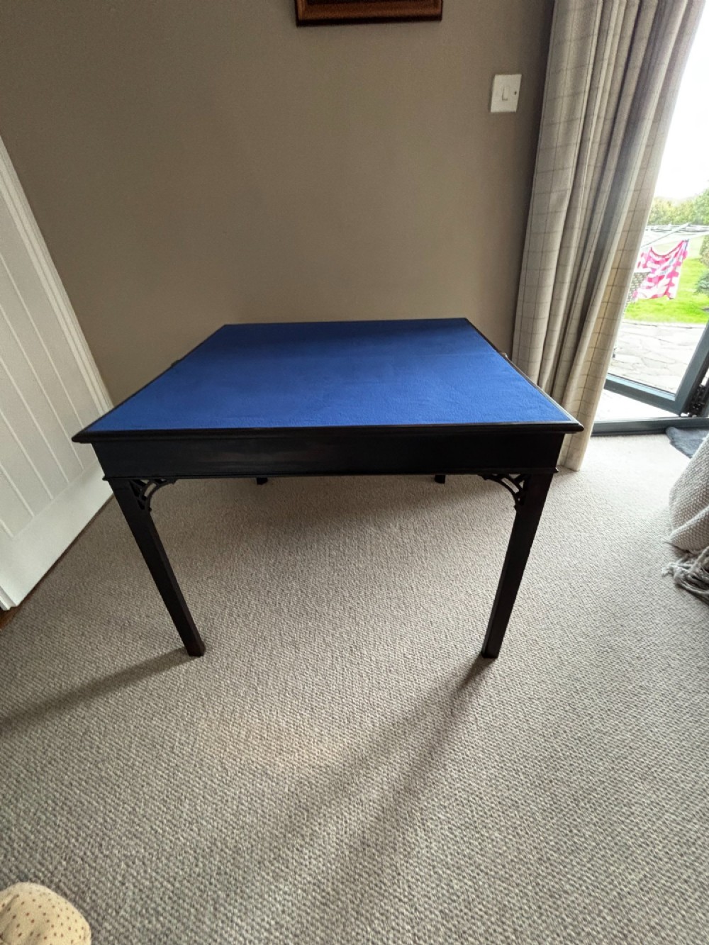 An 18th-century Chippendale mahogany card table with a rectangular fold-over top, pierced fretwork corner brackets, and straight square legs. View V