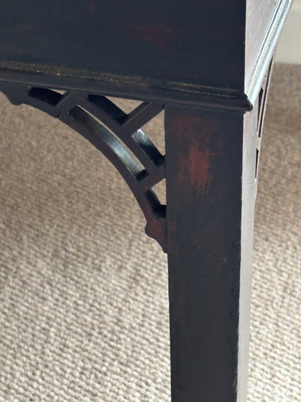 An 18th-century Chippendale mahogany card table with a rectangular fold-over top, pierced fretwork corner brackets, and straight square legs. View VIII