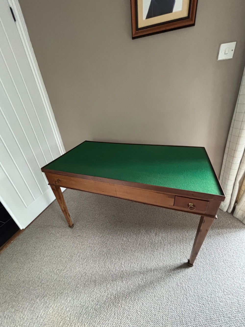 A French Empire mahogany tric-trac games table featuring a sunken central backgammon board with inlaid points and brass eyelets around the border. View IX