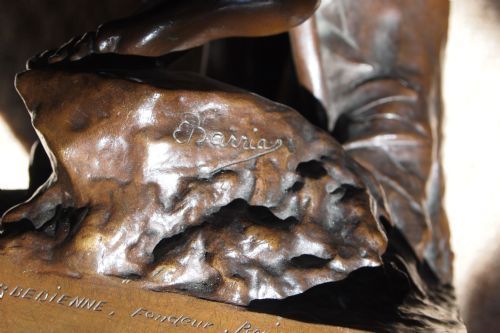 fig 1. A dark patinated bronze sculpture depicting Diana the Huntress draped in classical attire standing on a square bronze plinth.