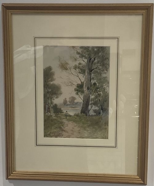 fig 1. A watercolour landscape depiction of a woodland dirt path with a large tree trunk and a figure walking near water under a overcast sky.