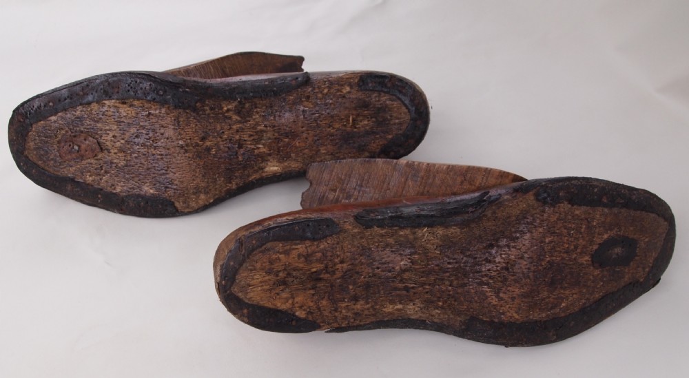 A pair of late 19th-century carved beechwood gents shoe lasts with a warm brown patinated finish and visible cobbler pin marks. View III