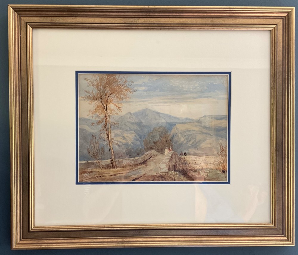 A 19th-century watercolour landscape painting depicting figures standing on a stone arch bridge with mountains in the background and a leafless tree on the left. View II