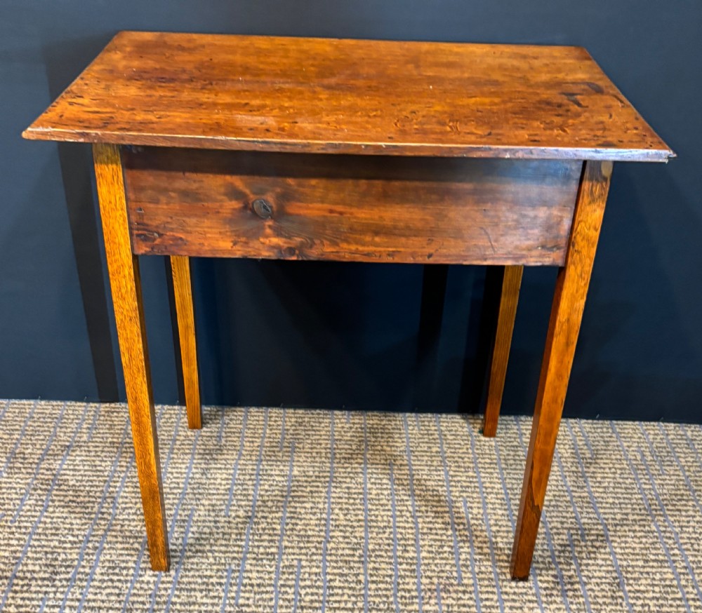 A 19th-century elm side table with a single drawer featuring two brass drop handles and square legs. View II