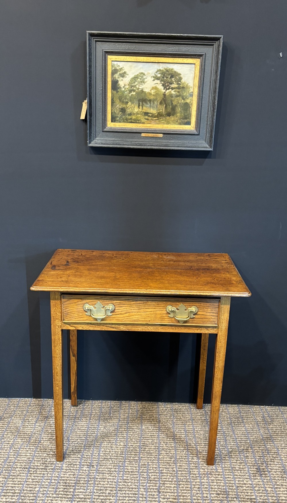 A 19th-century elm side table with a single drawer featuring two brass drop handles and square legs. View V