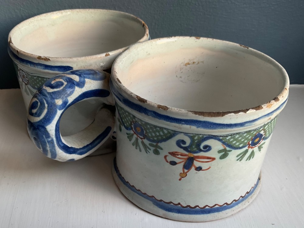 An 18th-century tin-glazed earthenware double sweetmeat dish with polychrome floral swags and lattice decoration on an off-white background. View II