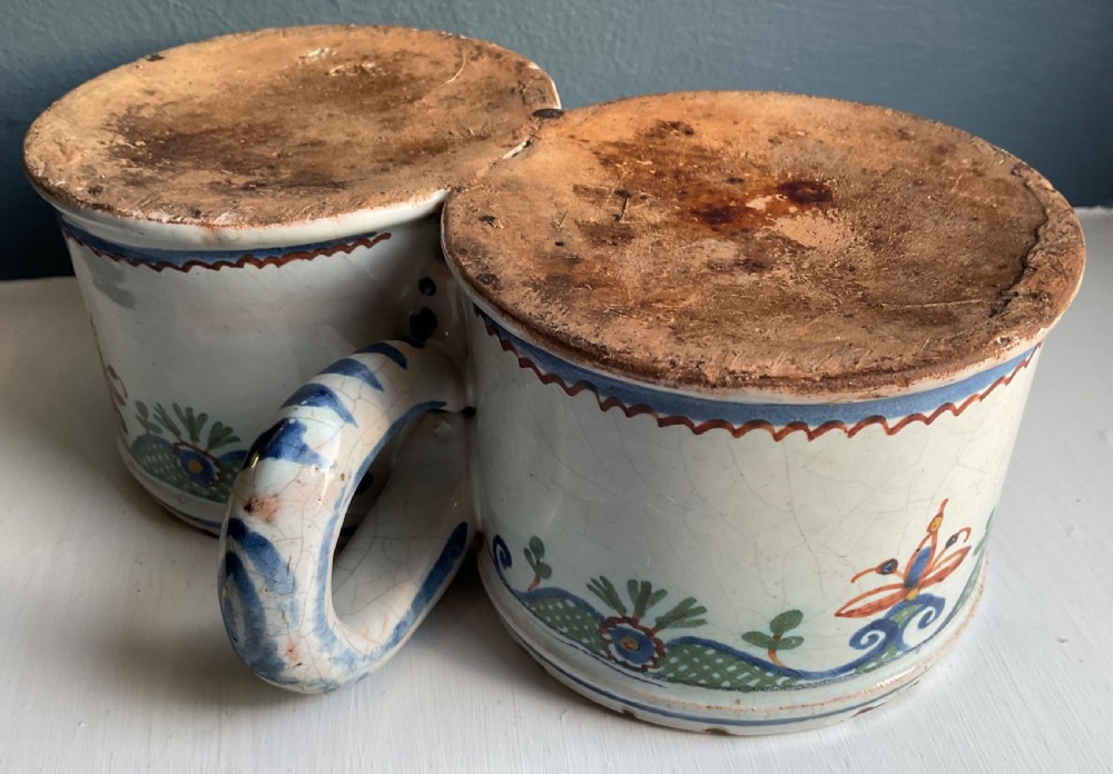 An 18th-century tin-glazed earthenware double sweetmeat dish with polychrome floral swags and lattice decoration on an off-white background. View III