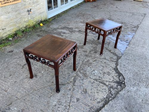A pair of side tables