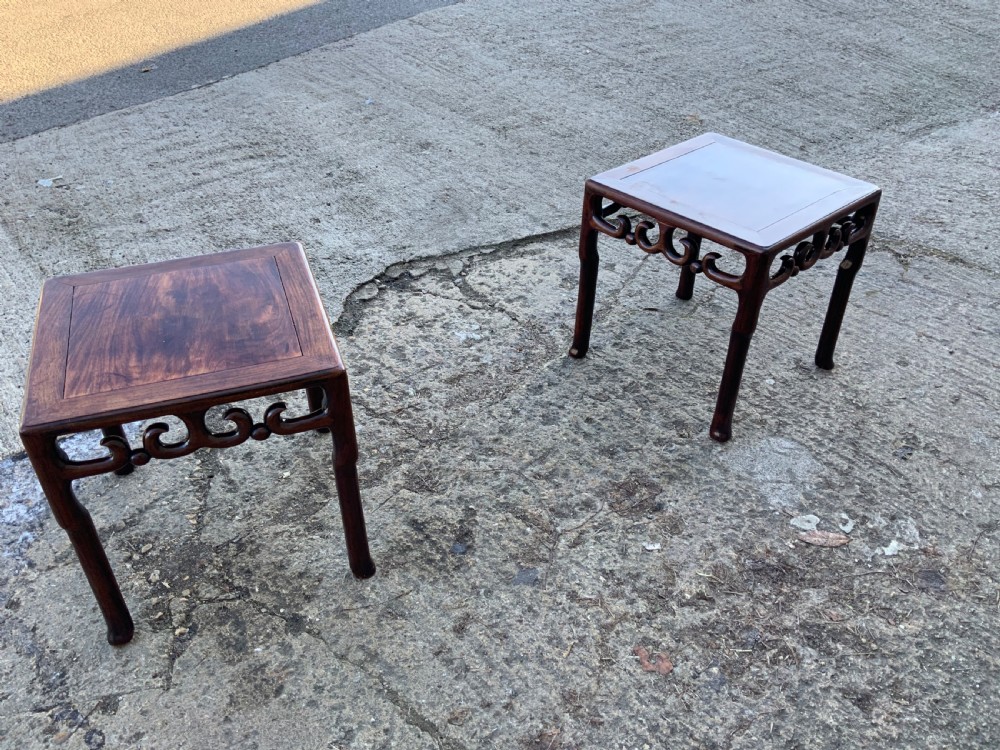 A pair of low square dark brown hardwood side tables featuring carved openwork scroll aprons and shaped legs. View III