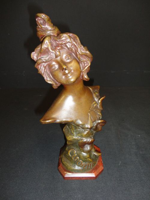 French Spelter Bust of a Female Set on a Rouge Marble Base.