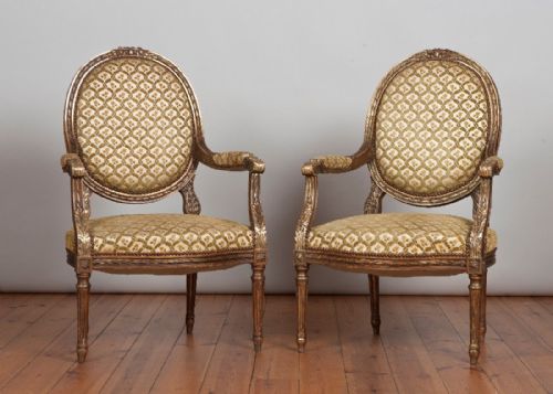 Pair of French Louis Xv1 Carved Wood and Gilt Upholstered Armchairs