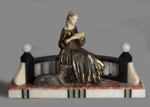 French Art Deco Spelter and Ivorine Sculpture Set on a Marble and Onyx Base.