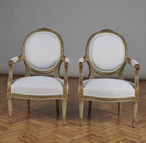 Pair of French Louis Xvi Style Painted and Gilt Cabriolet Armchairs.